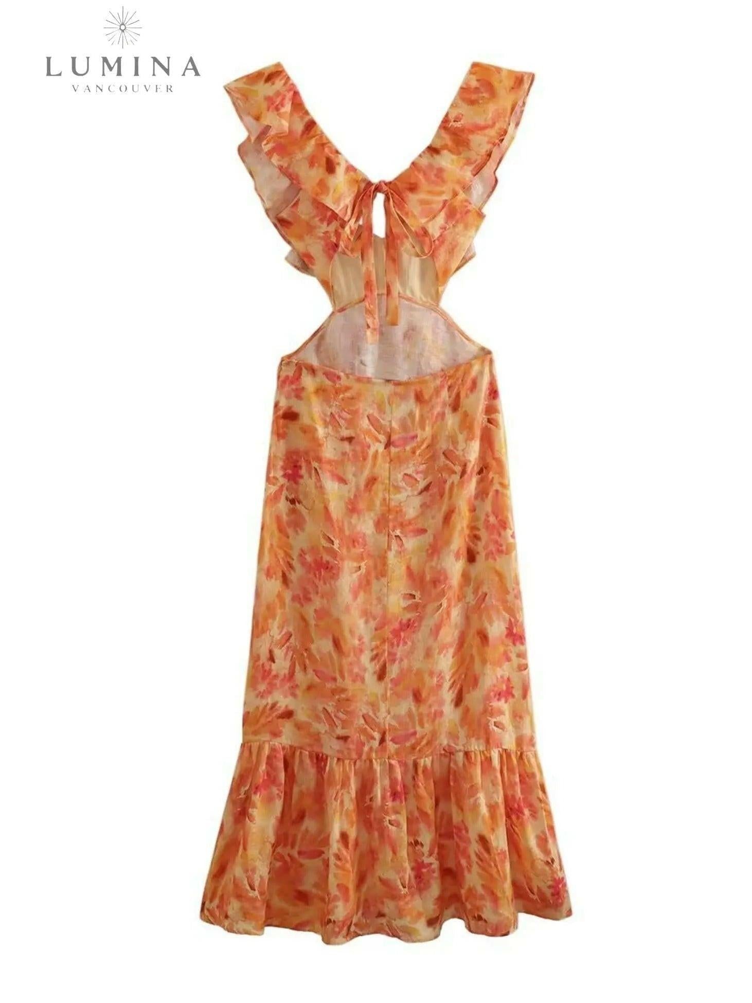 Orange Ariella floral ruffle dress by Lumina Vancouver, perfect for holiday vibes, size 4-6XS, with a feminine ruffled design.