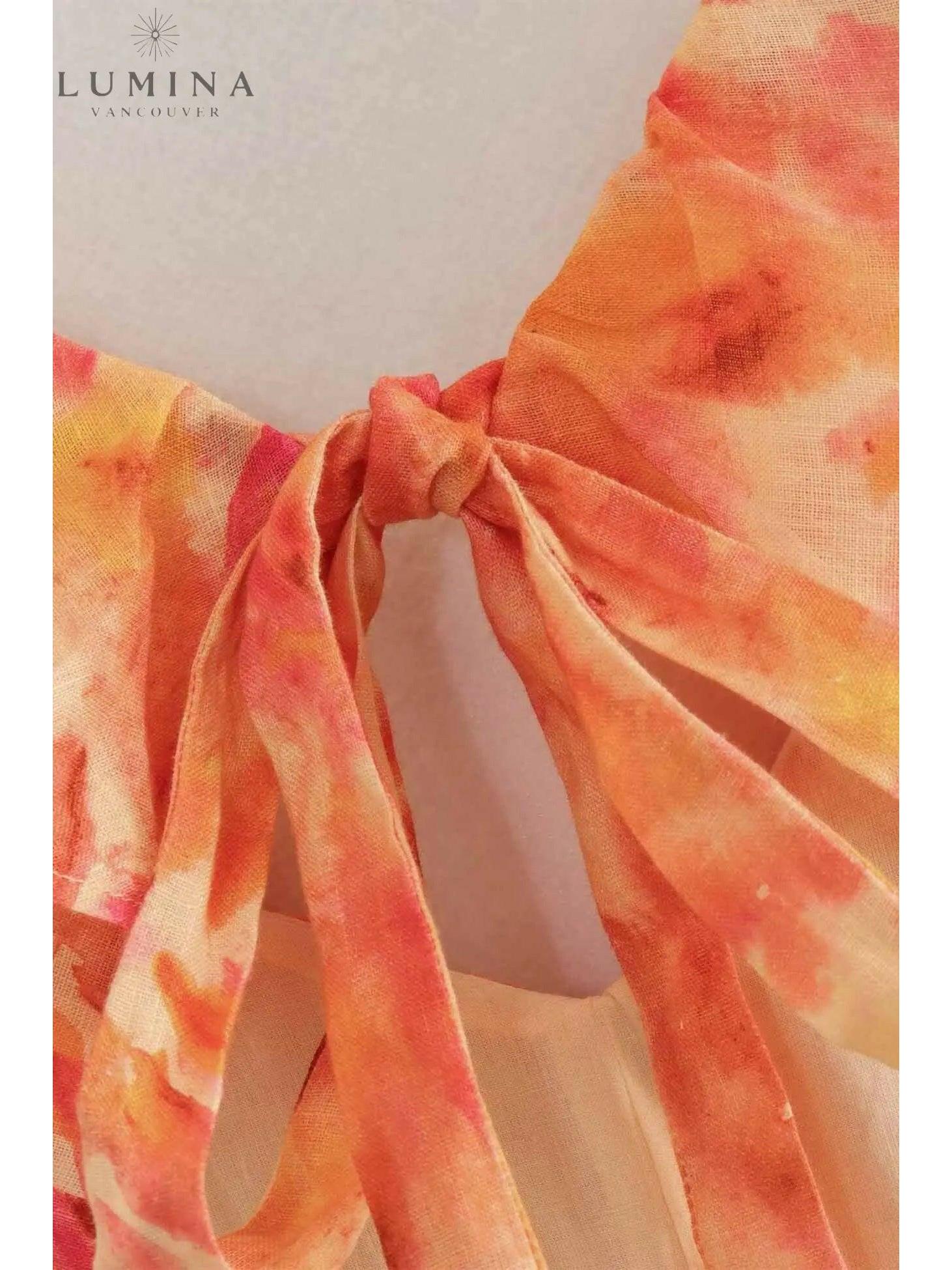 Ariella floral ruffle dress in orange, size 4-6XS, perfect for holiday vibes, by Lumina Vancouver.