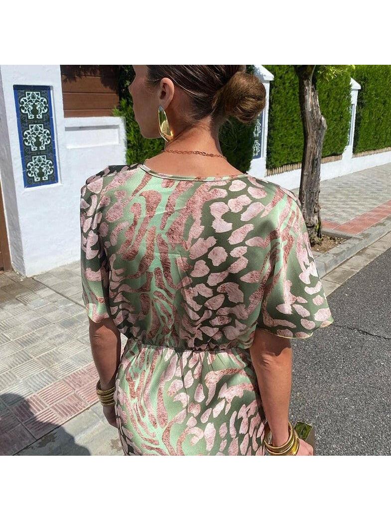 A brown Ariella maxi dress by Lumina Vancouver, elegant silk wedding guest gown with sophisticated style, perfect for formal events.
