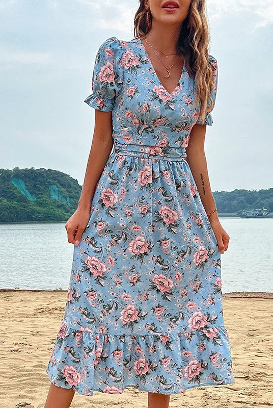 Aster floral print midi dress by Lumina Vancouver featuring a flowy silhouette and vibrant floral pattern.