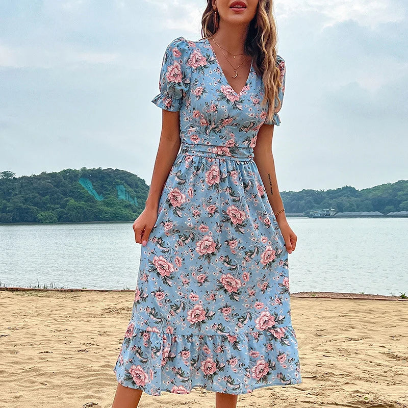 Aster floral print midi dress by Lumina Vancouver featuring a flowy silhouette and vibrant floral pattern.