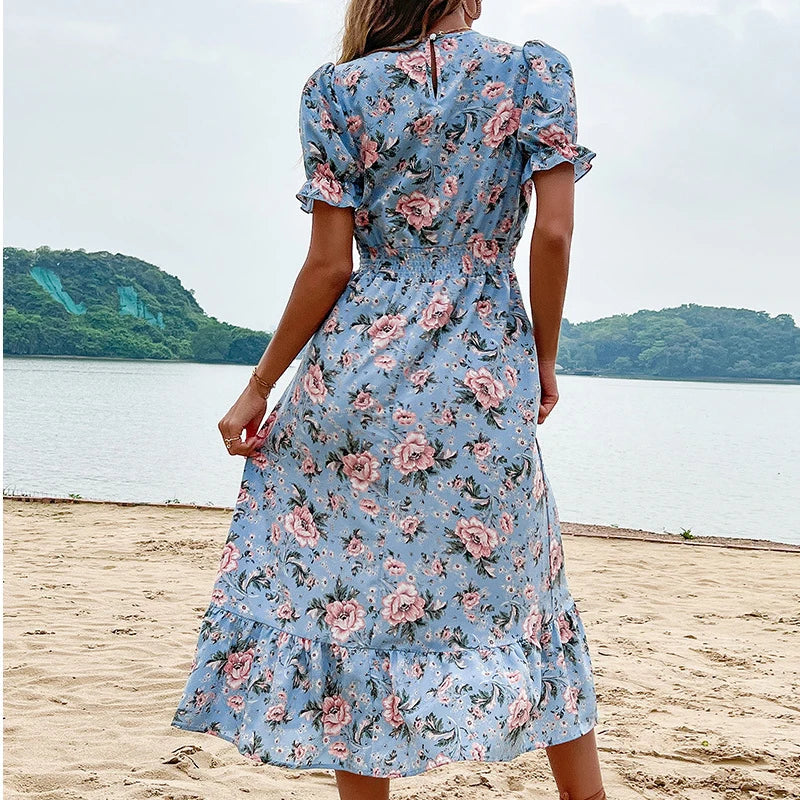 Aster floral print midi dress by Lumina Vancouver, featuring a fitted bodice and flowing skirt in vibrant floral patterns.