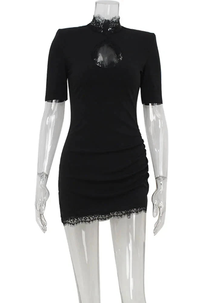 Black Nanna mini dress by Lumina Wear featuring a bodycon fit, displayed on a mannequin against a plain background.