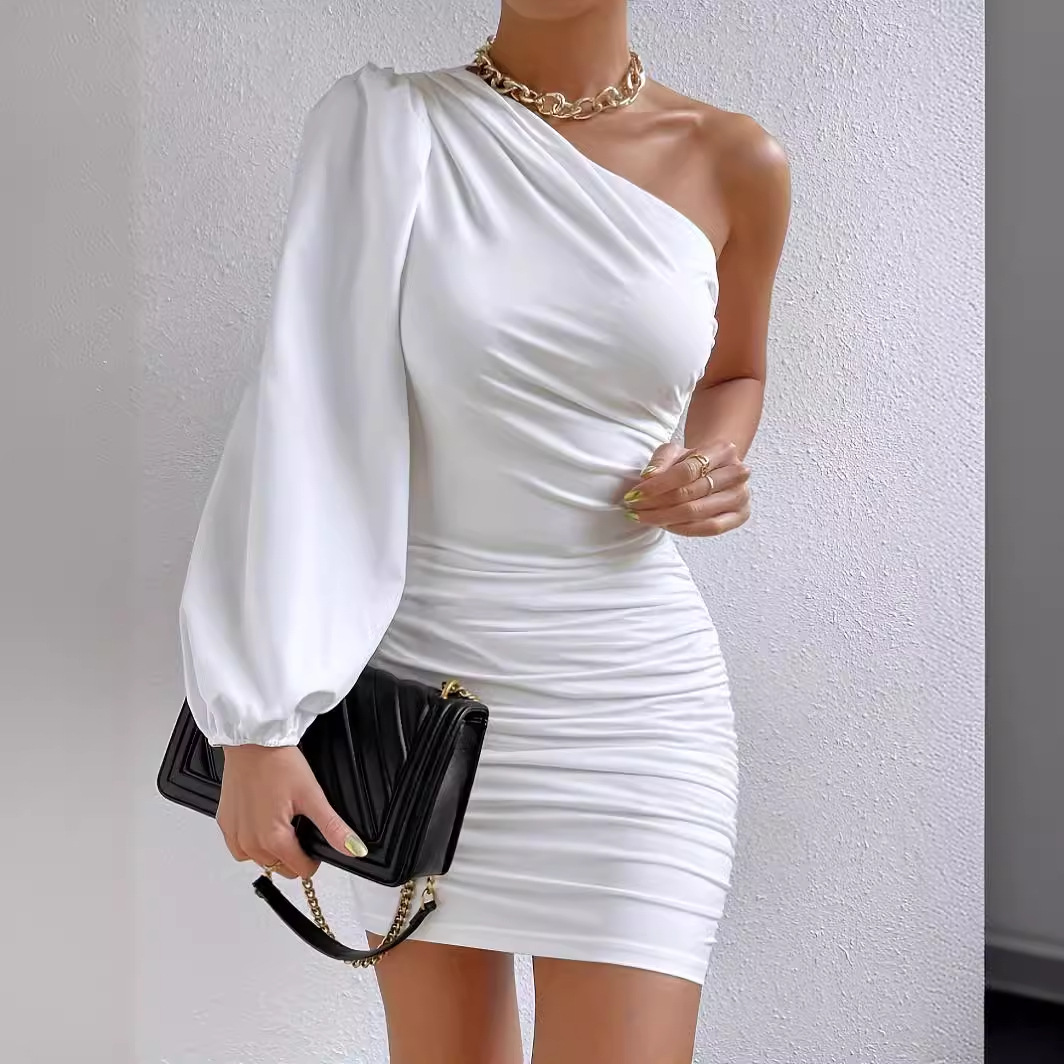 White Eir One-Shoulder Mini Dress with ruched details by Lumina Vancouver, shown on a model against a plain background.