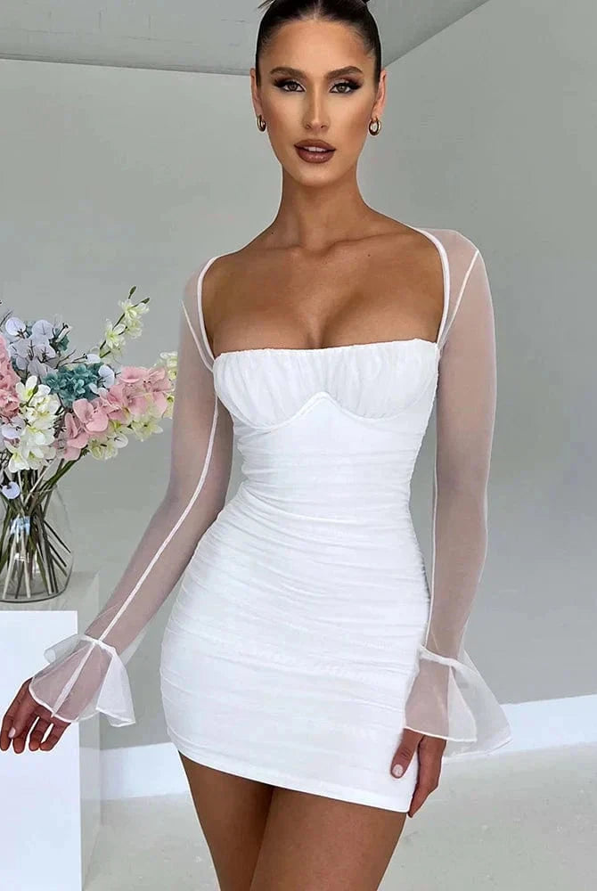 A white Astraeon Lumina bodycon mini dress with ruched detail, displayed on a mannequin, perfect for stylish evening wear.