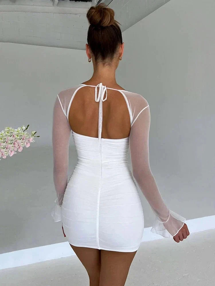 Astraeon Lumina white bodycon mini dress with ruched design, fitted style, and sleeveless cut, perfect for stylish occasions.
