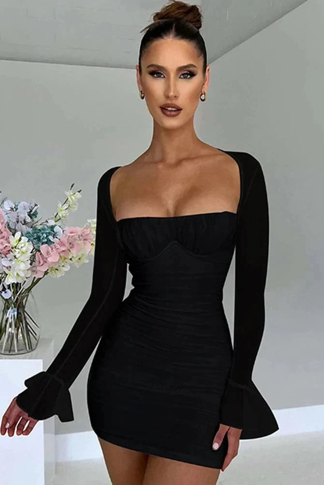 White Astraeon bodycon mini dress with ruched design from Lumina Vancouver, shown on a model in a close-up fashion shot.