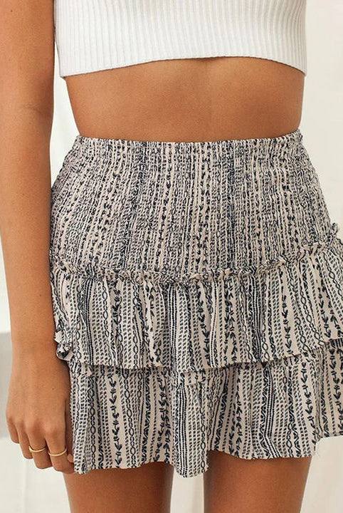Dark pink Aurelie bohemian skirt with playful ruffles and vibrant print by Lumina Wear, perfect for casual or boho-style outfits.
