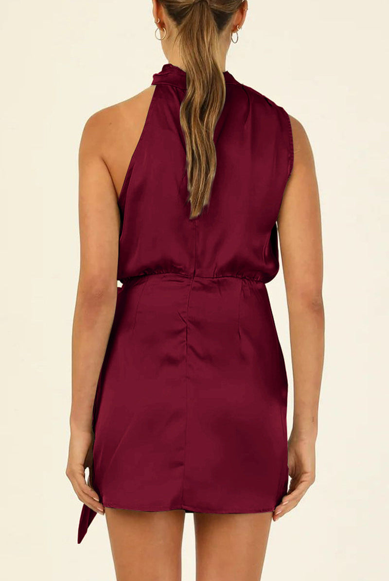 Lumina Wear Kaisa Belle satin halter mini dress in apricot color, featuring a sleek halter neckline and fitted silhouette.