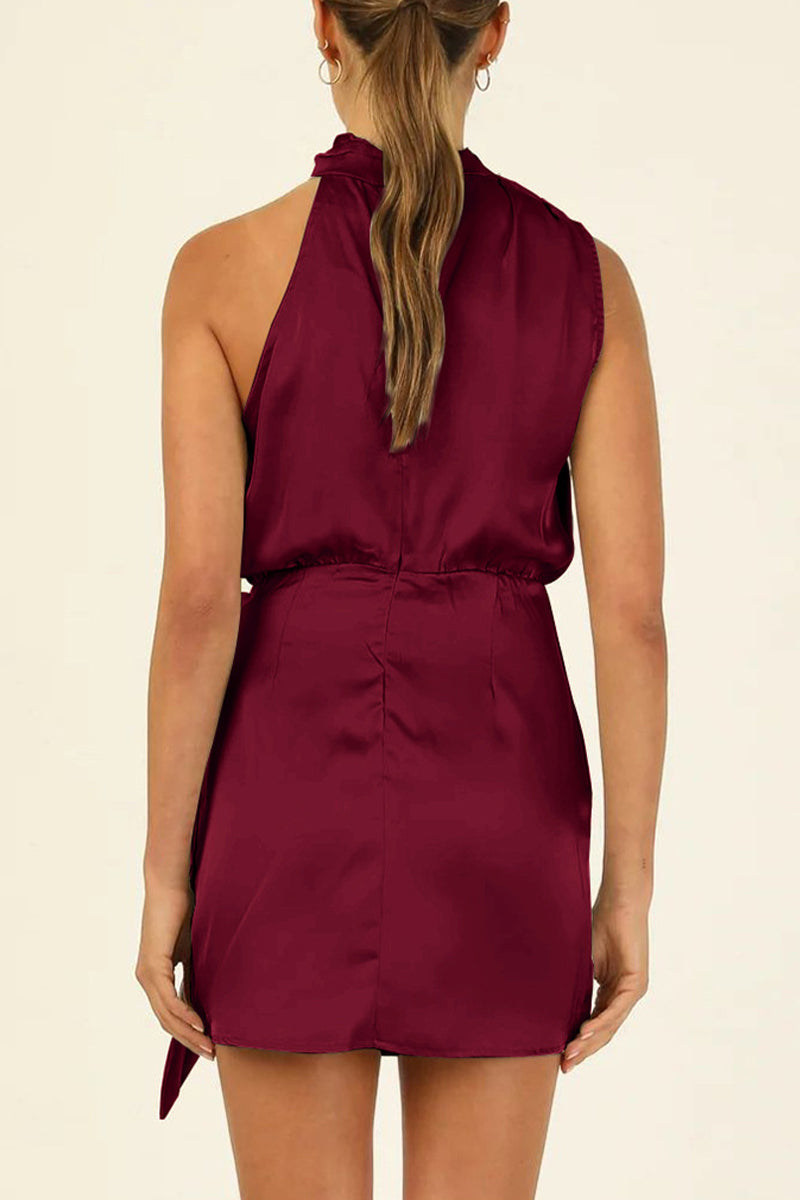 Kaisa Belle satin halter mini dress in apricot by Lumina Vancouver, featuring a sleek fit and elegant halter neckline.