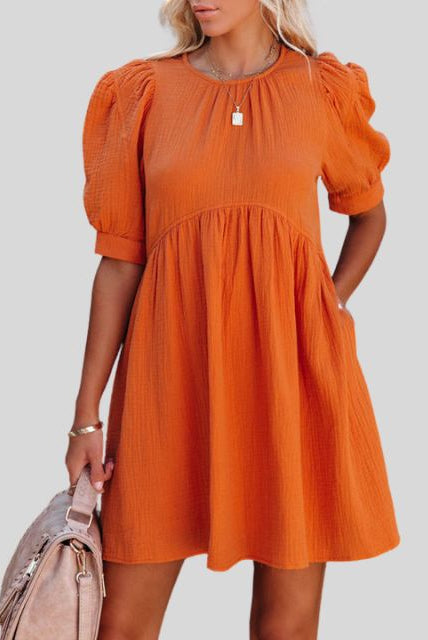 Lumina Wear Lempi Celeste Moonshadow mini dress in orange, featuring a short, stylish design with celestial moonshadow pattern.