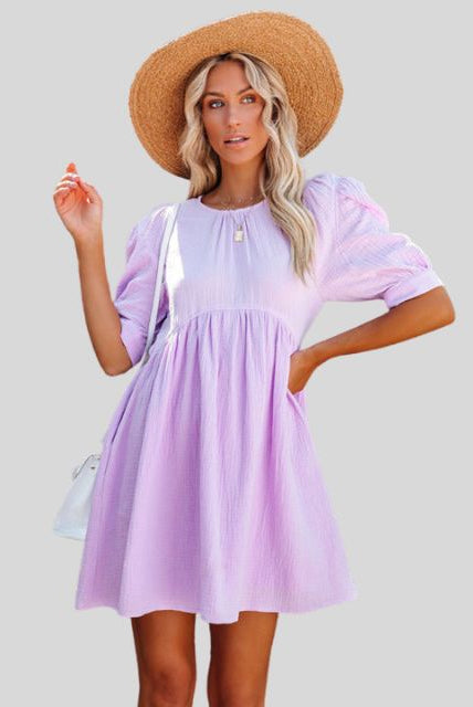 Lumina Wear Lempi Celeste Moonshadow mini dress in orange, short style with moonshadow design, perfect for summer events.