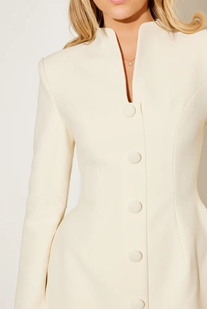 Lumina Vancouver Aurora coat dress with a statement bow collar in white, showing the elegant design and tailored fit.