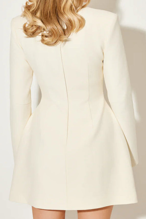 White Aurora coat dress with a statement bow collar by Lumina Vancouver, shown from the front with a clean, elegant design.