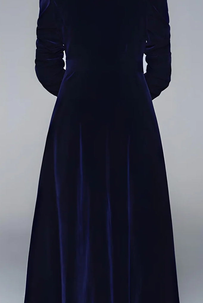 Lumina Vancouver double-breasted long coat in midnight blue velvet, showcasing elegant collar and tailored fit.