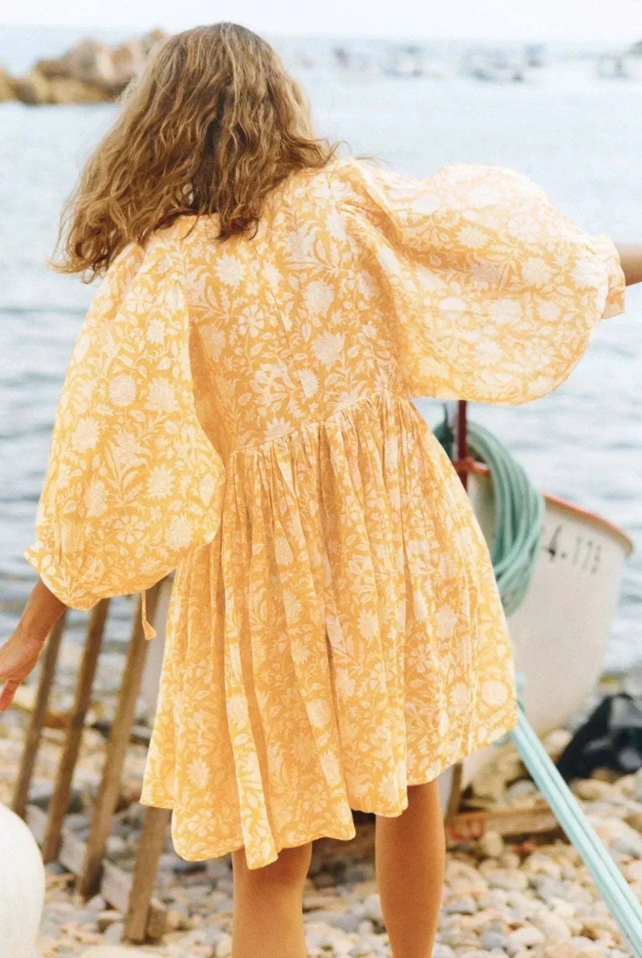 Blue Aurora Flow Boho Floral women's mini dress by Lumina Vancouver, featuring a flowy design and vibrant floral pattern.