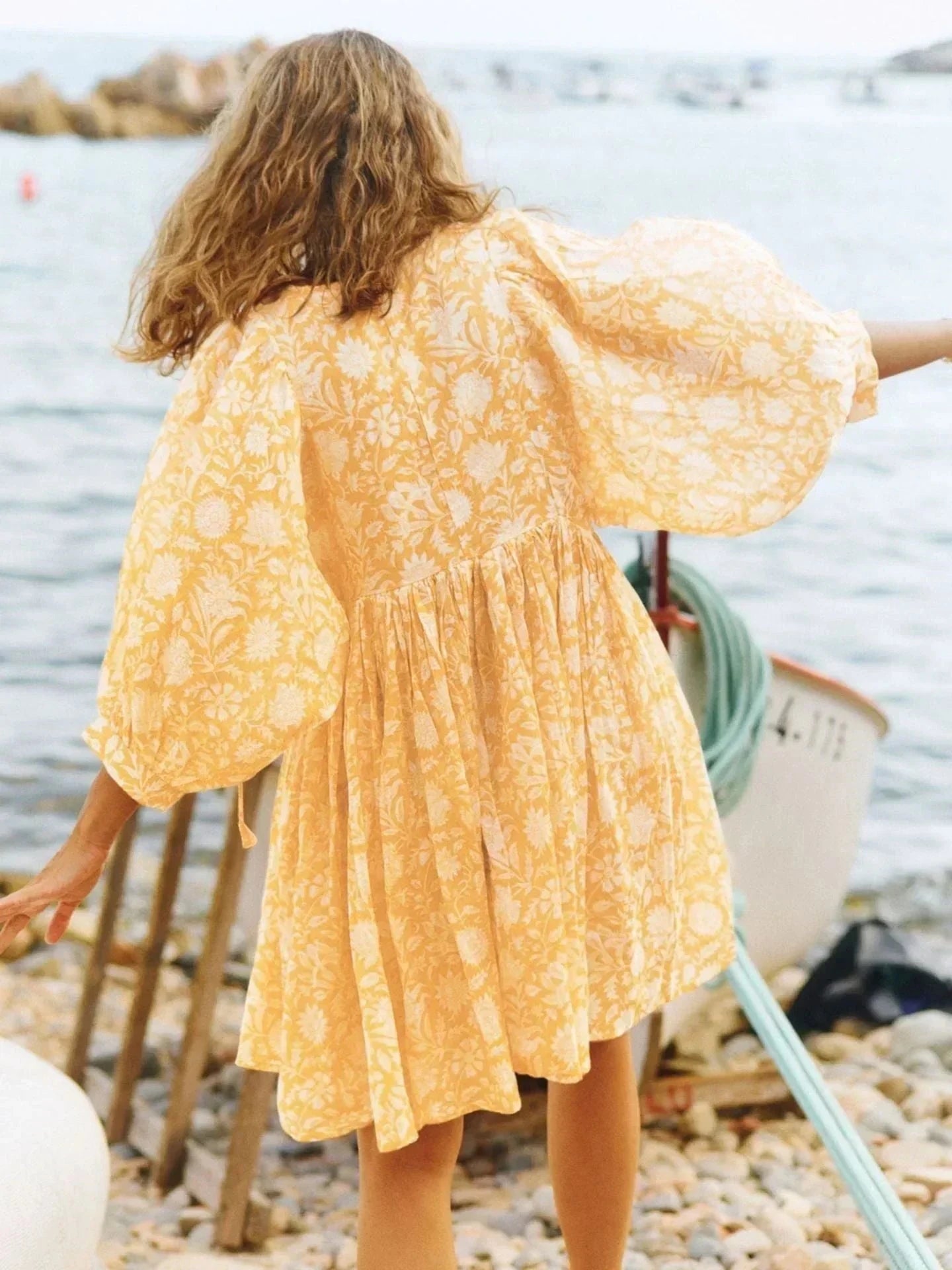 Blue Aurora Flow Boho Floral women's mini dress by Lumina Vancouver, featuring a flowy design and vibrant floral pattern.
