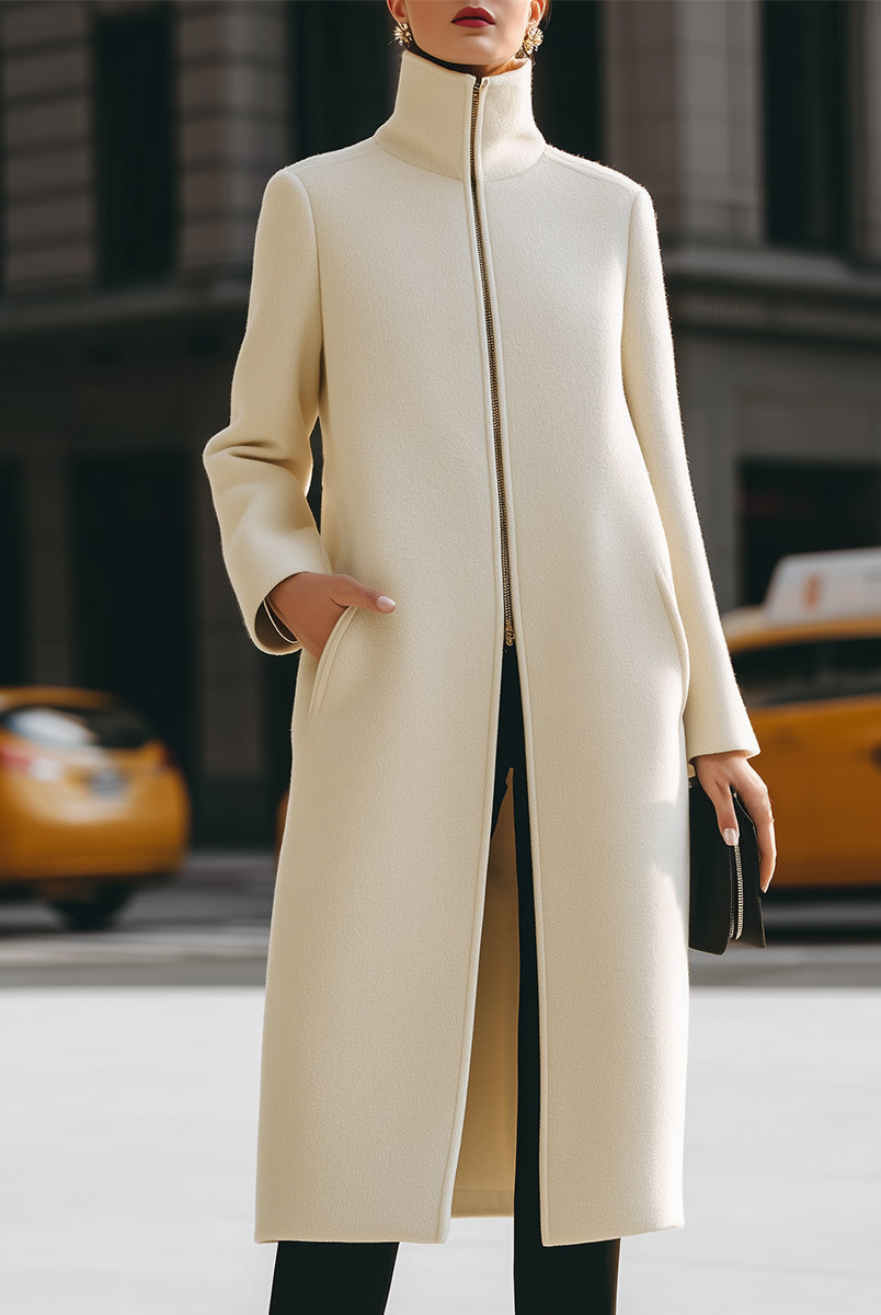 Cream high-neck zip front maxi coat by Lumina Vancouver, showcasing its elegant design and cozy winter style.