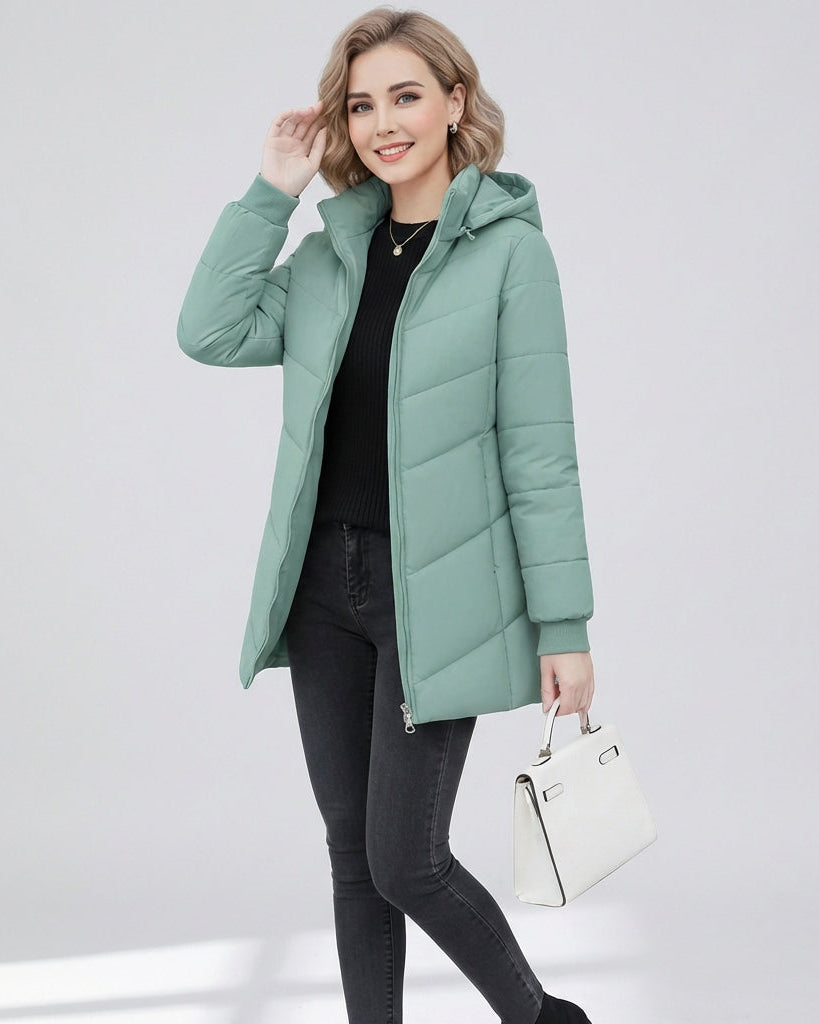 Aqua green Lumina Wear Ava quilted hooded puffer jacket with streamlined fit and quilted design, shown on a model.
