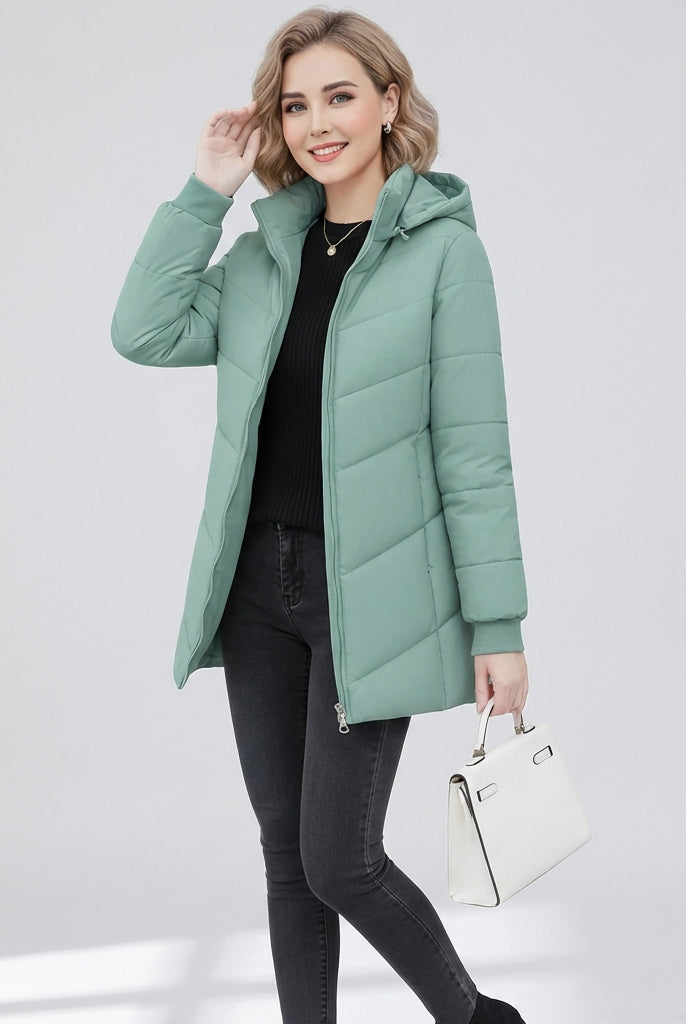 Green Ava Lumina Wear quilted hooded puffer jacket with a sleek, streamlined fit, shown on a model in size XS.