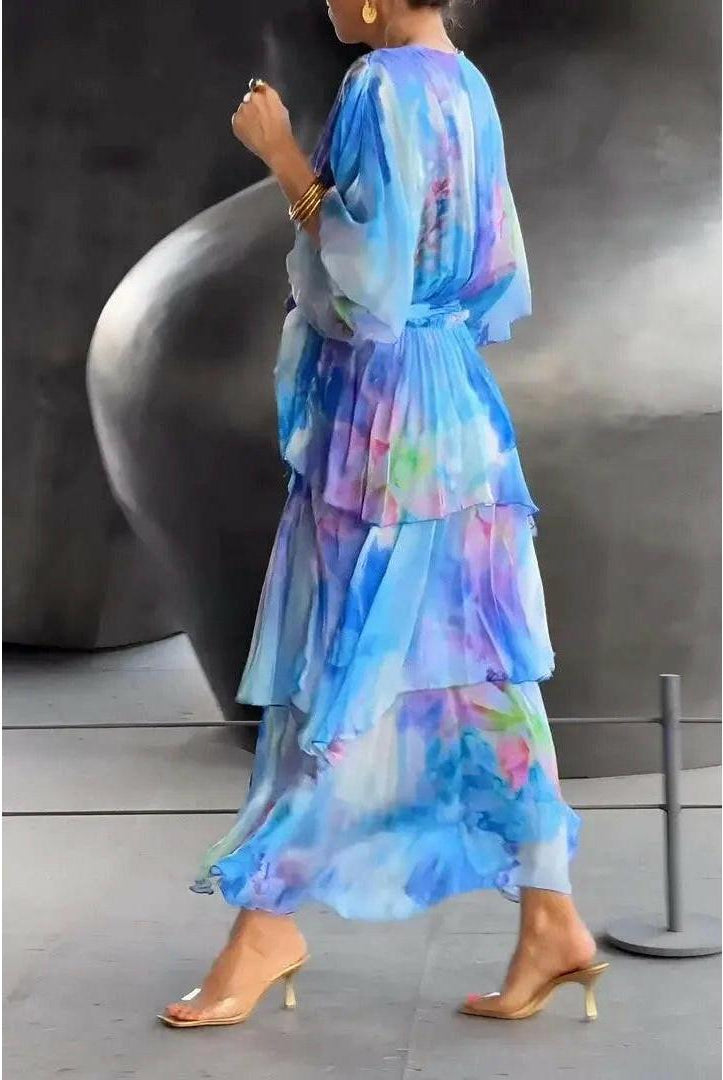 Light blue Lumina Wear Avalance chic multi-color maxi dress with elegant flowing fabric and vibrant pattern.