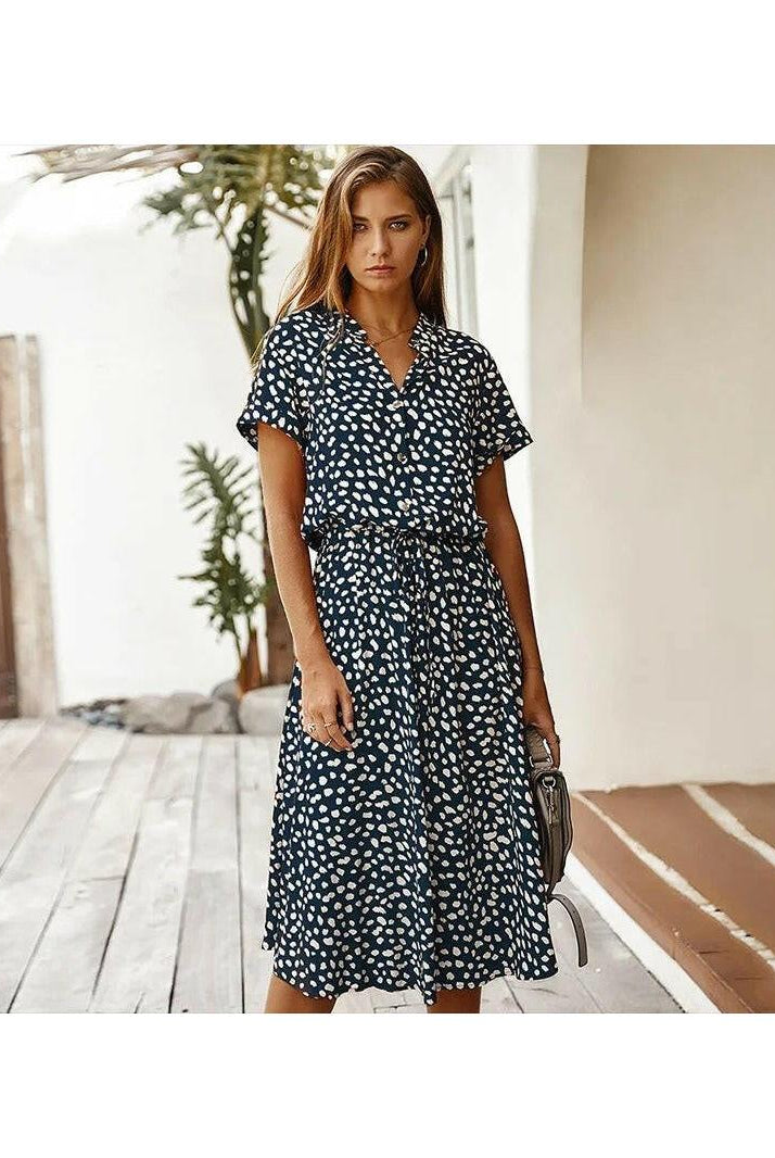 Light-colored printed summer dress by Lumina Wear featuring a flowy design, perfect for warm weather.