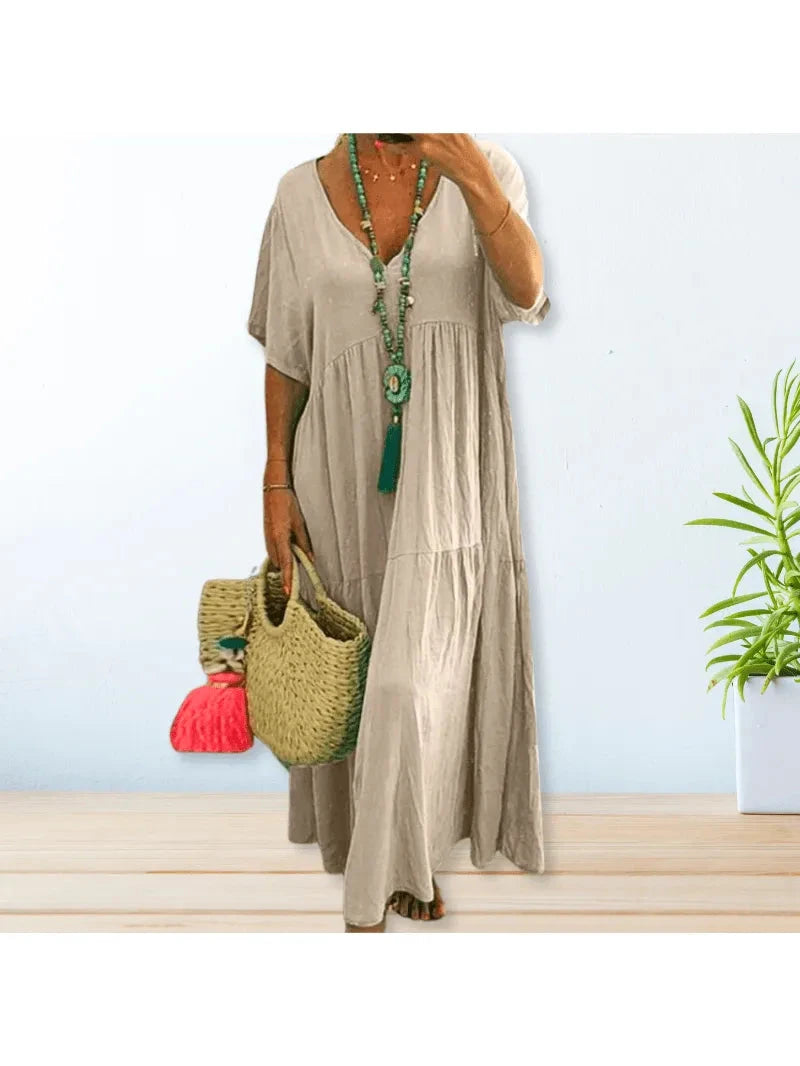 Beige Lumina Wear BAHAMA cotton linen dress displayed on a hanger, showcasing its relaxed, breathable fabric and casual style.
