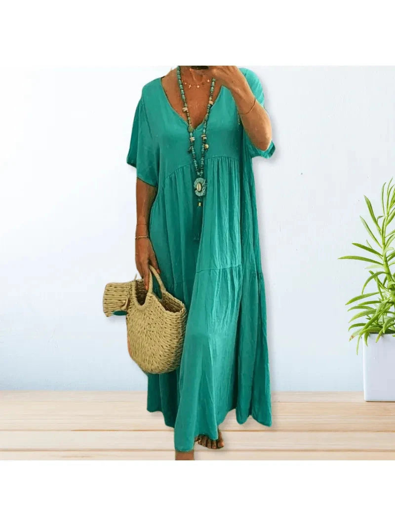 Beige Lumina Wear BAHAMA cotton linen dress with a relaxed fit, displayed on a hanger against a neutral background.