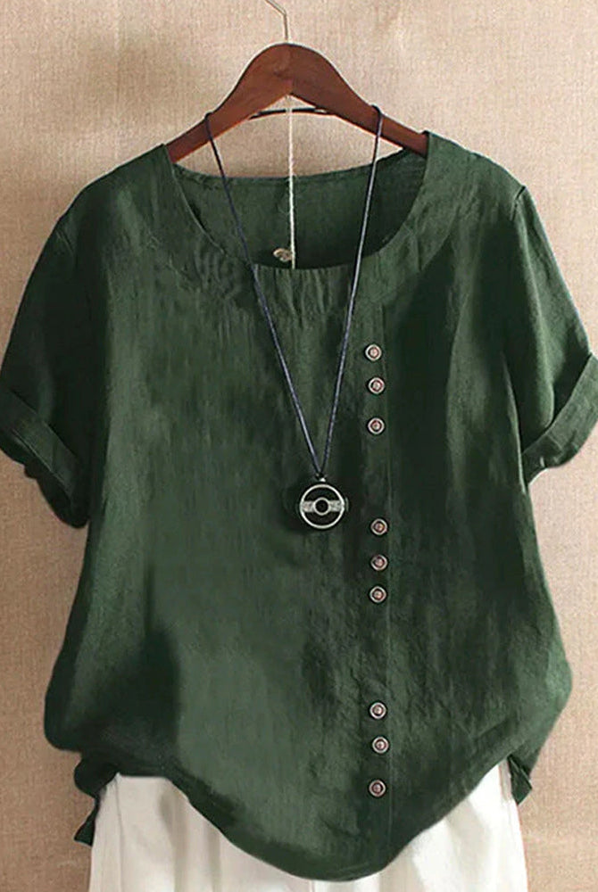 Light pink Beatrice casual blouse with button details from Lumina Wear, relaxed fit, shown on a hanger.