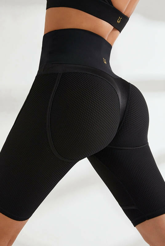Black Lumina Wear yoga bra and bicycle shorts bundle, quick-drying sports bra with comfortable fit and supportive design.