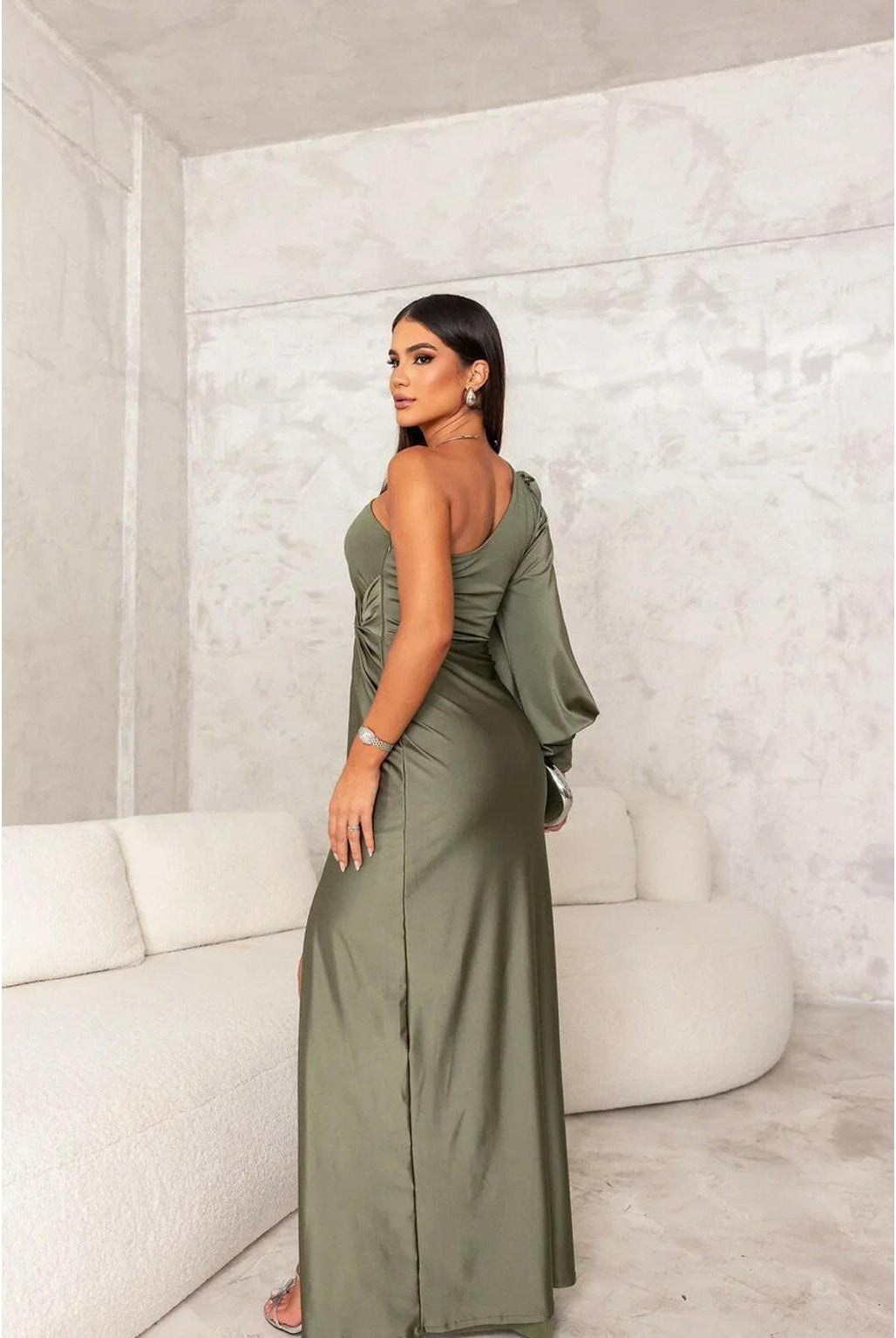 Olive green Becca Lumina Wear satin maxi dress with elegant design, suitable for wedding guests, shown on a model.