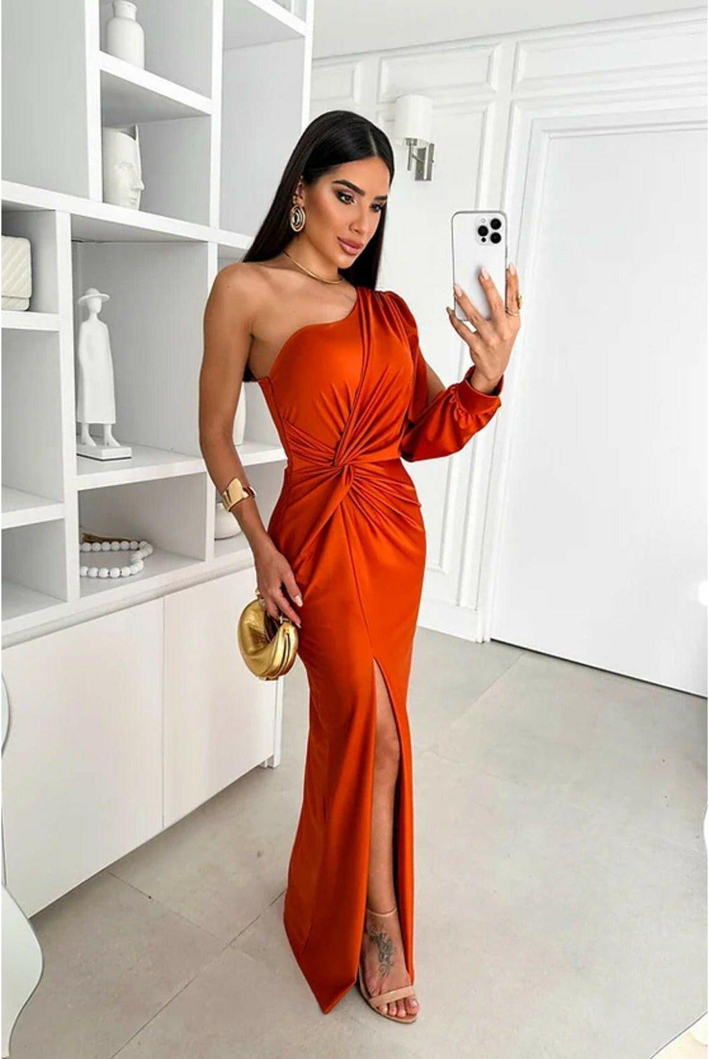 Olive green Becca Lumina Wear elegant satin maxi dress, sleeveless design, perfect for wedding guests, shown on a model.