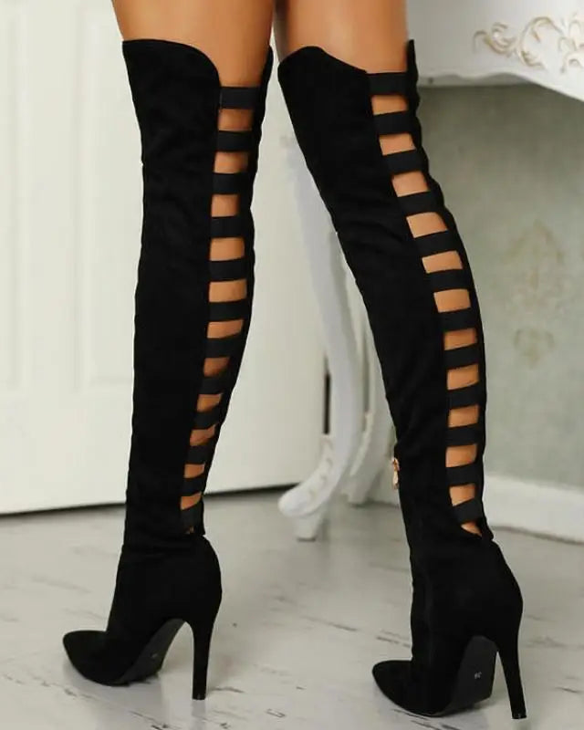 Black high heel boots for women featuring daring cutouts, from Lumina Wear's Bella collection, with sleek pointed toes and stiletto heels.
