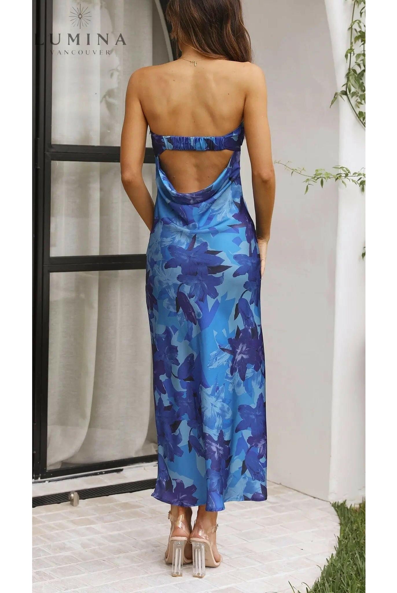Pink Bellamy sleeveless floral maxi dress by Lumina Wear, perfect for wedding guests, featuring a flowing design and vibrant floral pattern.