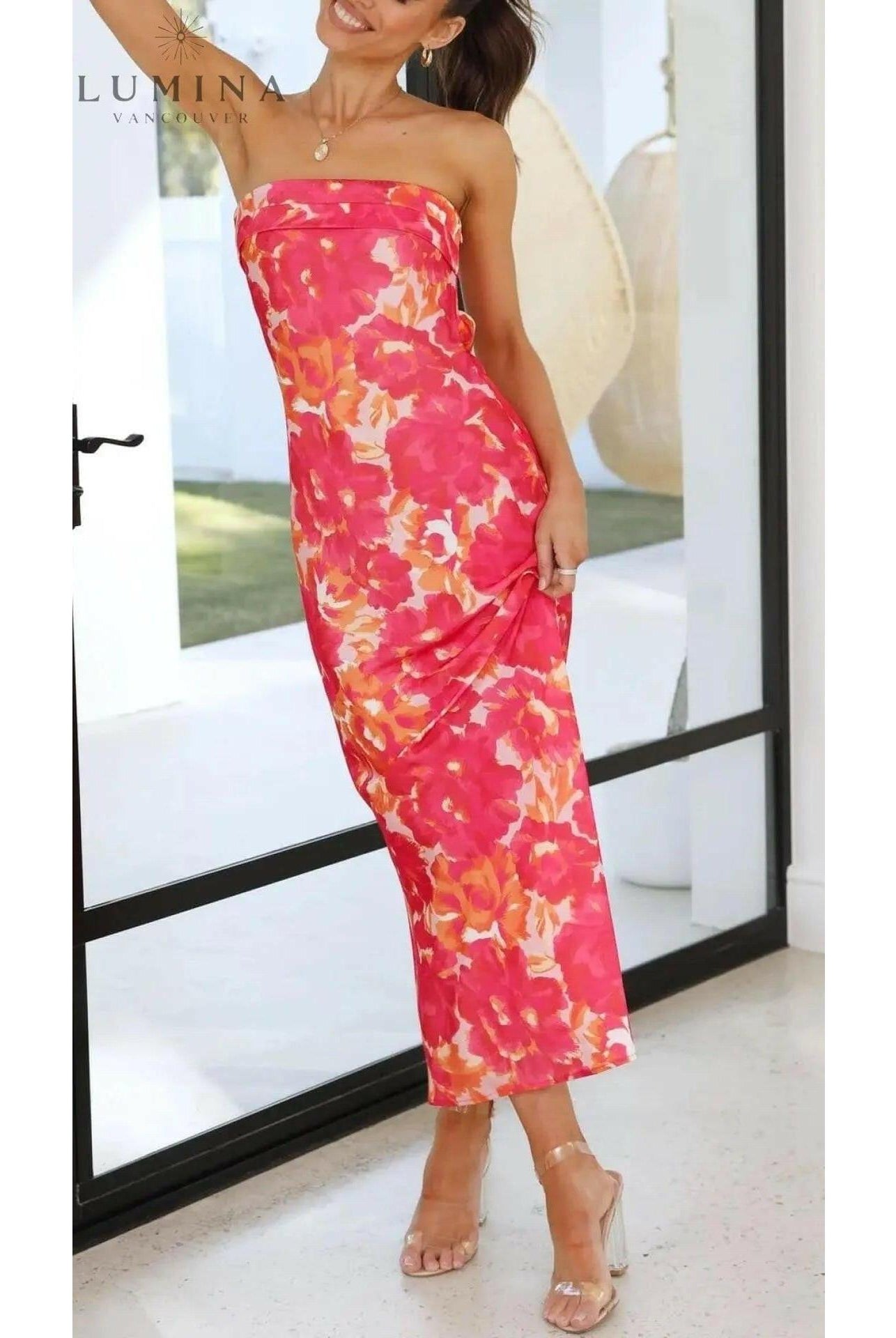 Pink Bellamy sleeveless floral maxi dress by Lumina Wear, perfect for wedding guests, shown on a size 8-10 model.