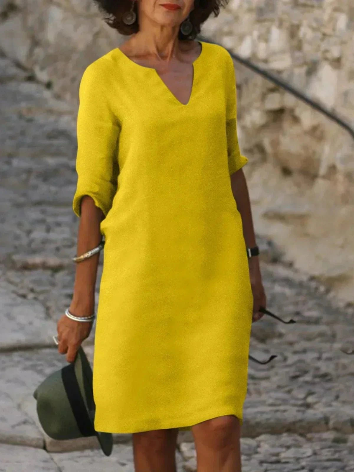 Black Beth™ relaxed V-neck dress by Lumina Vancouver, showcasing its comfortable fit and elegant design.