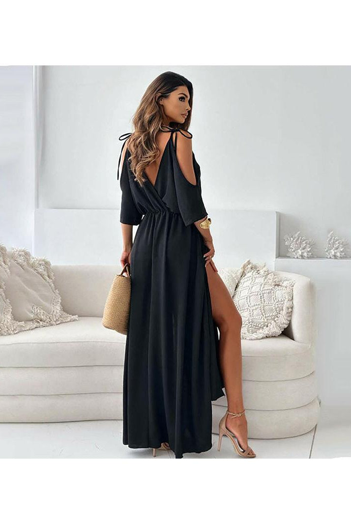 Red Billie V-neck maxi dress with trendy slit skirt by Lumina Vancouver, shown on a model. Elegant and stylish for special occasions.