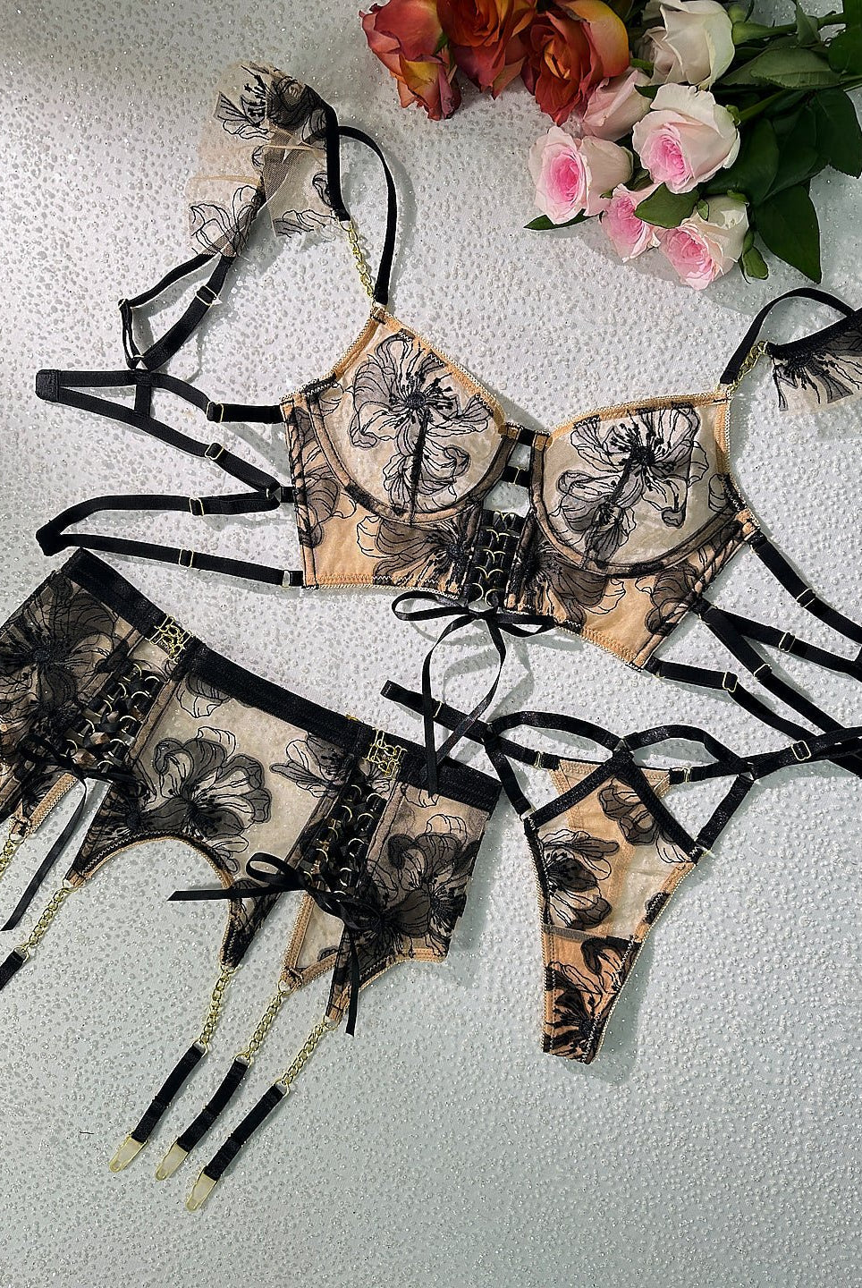 Black and nude ribbon sculpting body lingerie set by Lumina Wear, featuring three-piece design with lace and satin details.