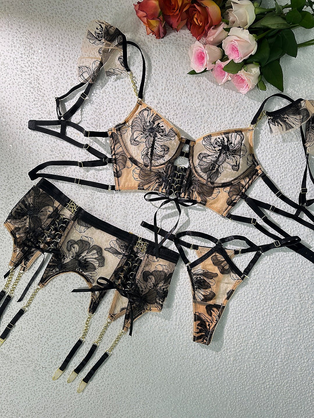 Black and nude ribbon sculpting body lingerie set, 3-piece by Lumina Vancouver, featuring intricate design and adjustable straps.