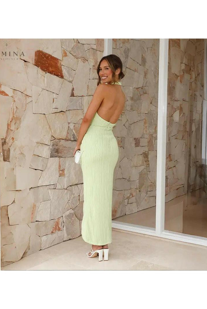 Green Brianna backless evening dress by Lumina Wear, stylish and elegant for wedding guests, shown on a model.