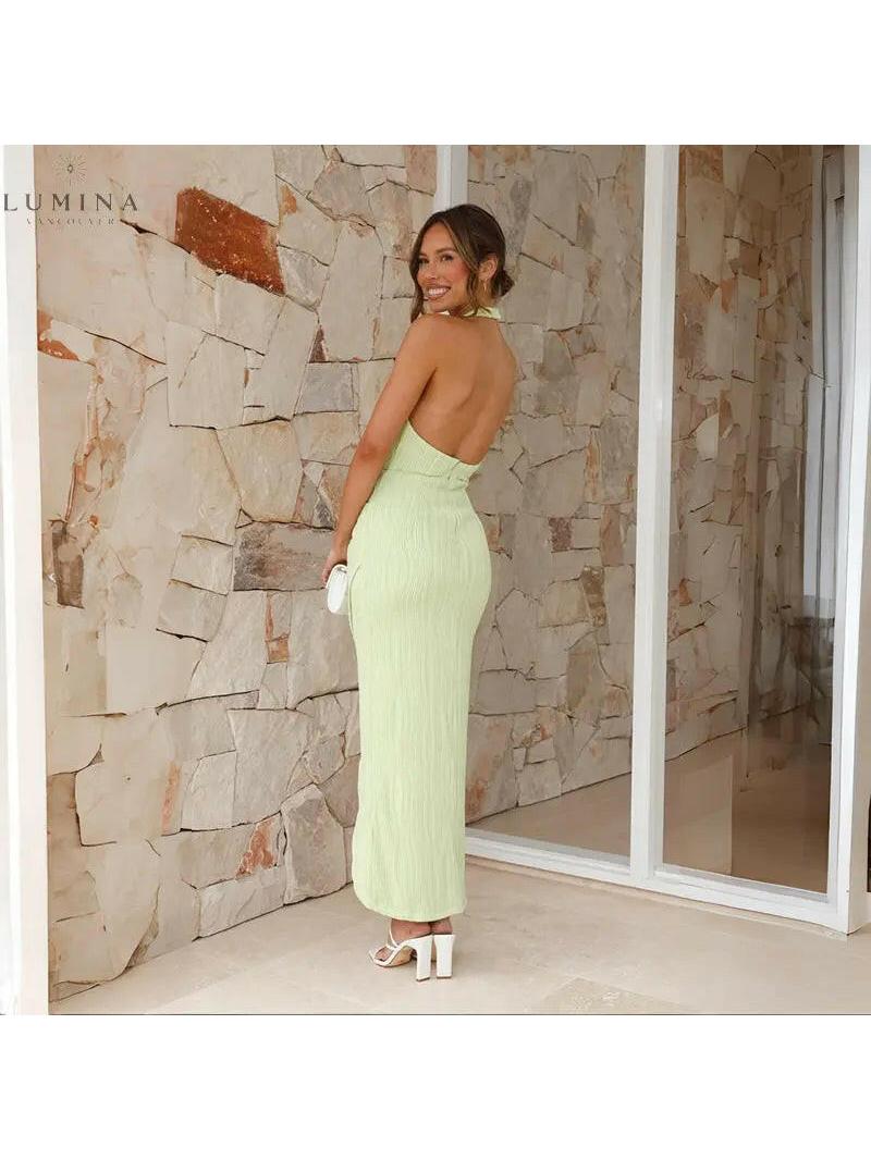 Green Brianna backless dress by Lumina Vancouver, elegant wedding guest dress with a stylish open back and fitted silhouette.