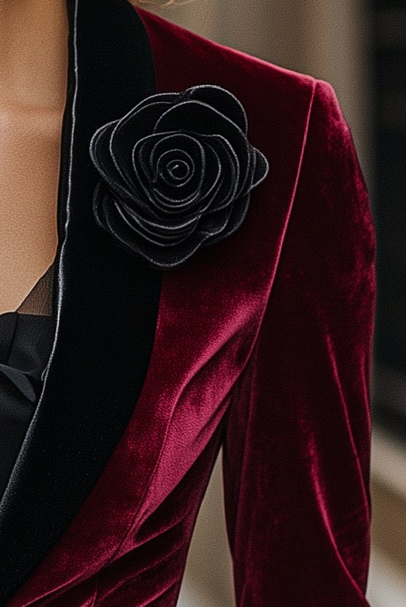 Burgundy velvet blazer with satin lapels and black rose detail from Lumina Wear, shown on a model.