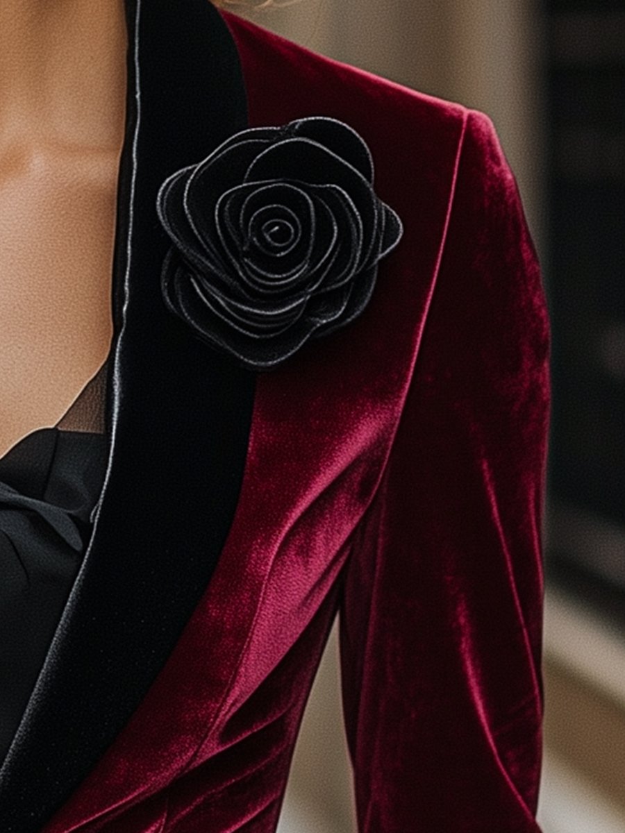 Burgundy velvet blazer with satin lapels and black rose detail from Lumina Wear, shown on a model.