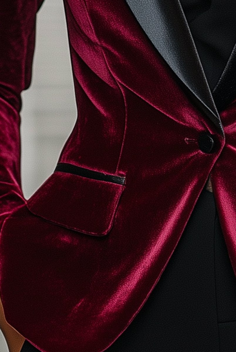 Burgundy velvet blazer by Lumina Wear with satin lapels and black rose detail, shown on a hanger.
