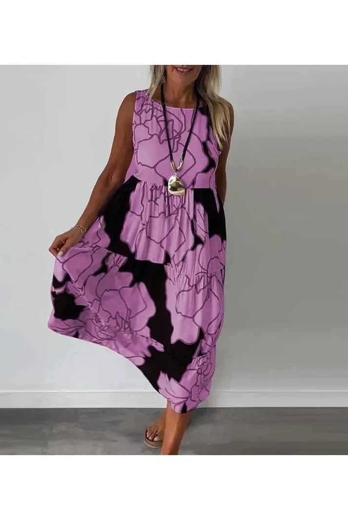 Brown Caitlyn™ sleeveless maxi dress by Lumina Vancouver displayed on a hanger, showcasing its flowing fabric and elegant design.