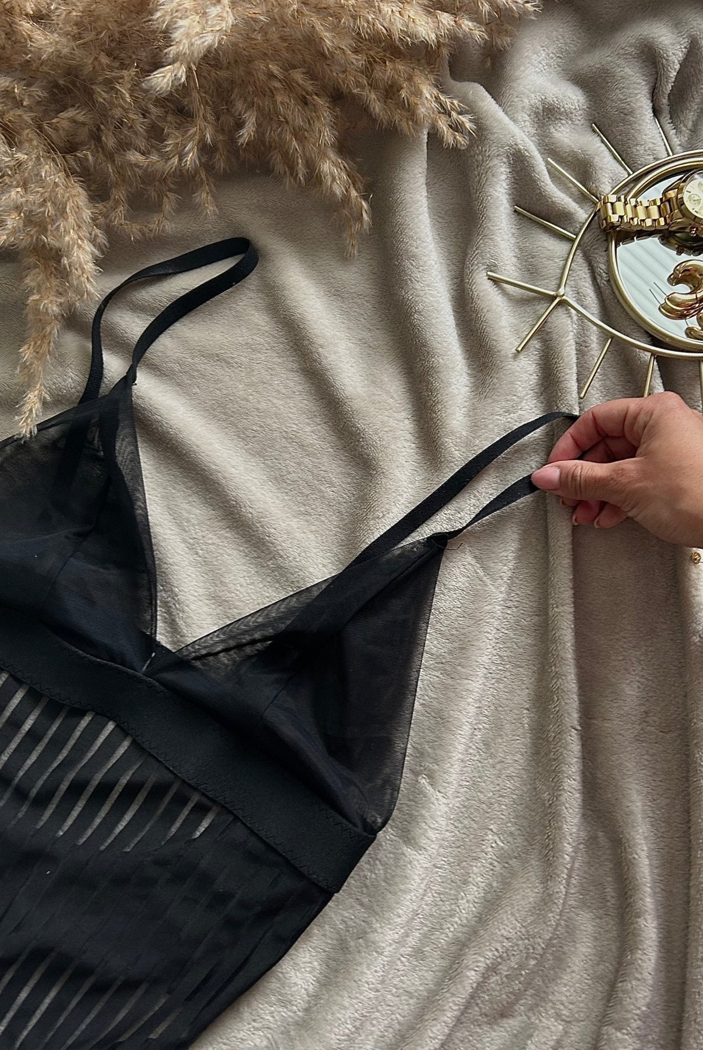 Lumina Wear Emmanuelle Bodysuit featuring sleek fabric and fitted design, shown on a model.