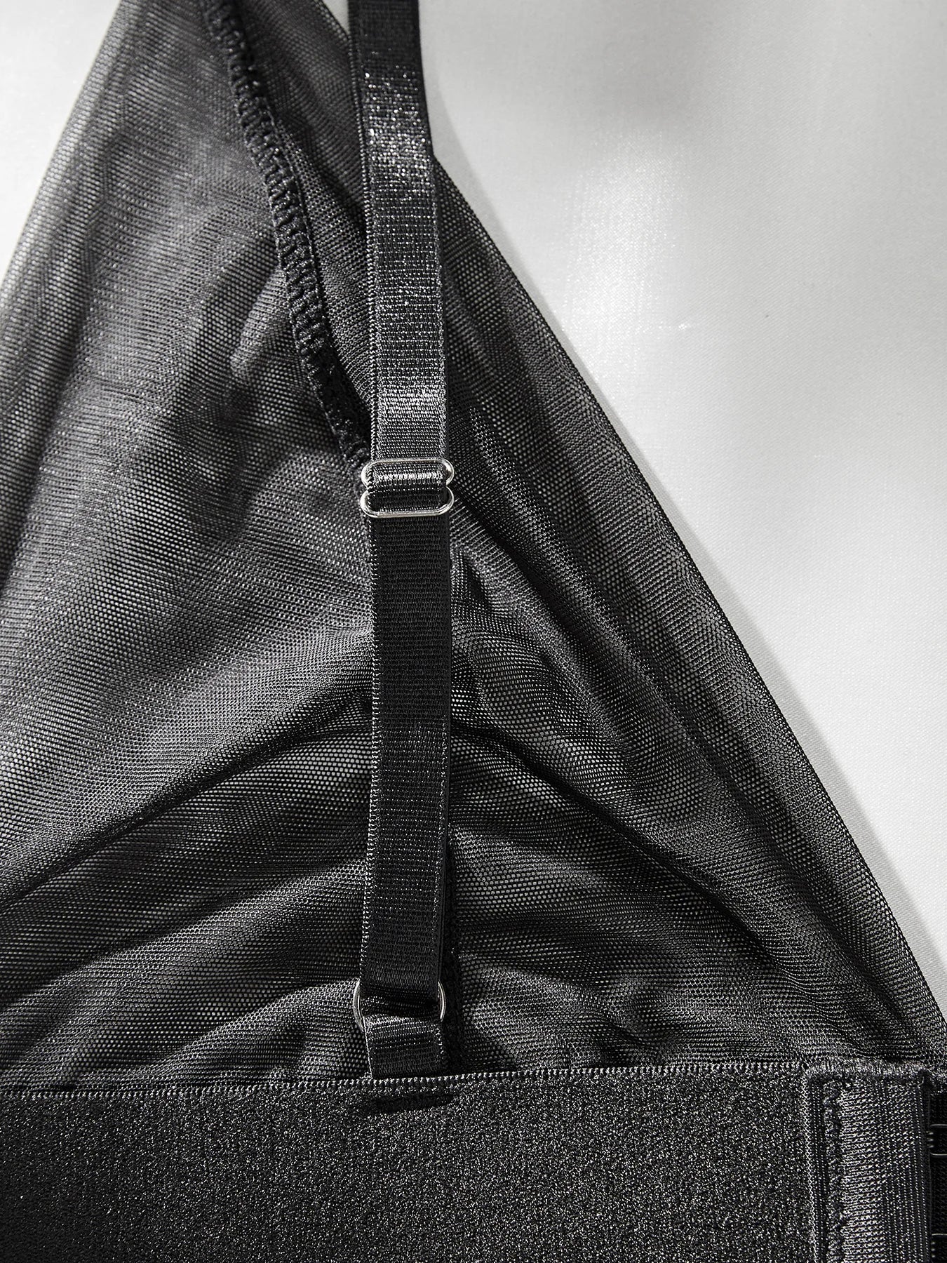 Lumina Vancouver Emmanuelle Bodysuit, close-up of sleek black bodysuit with fitted style and subtle detailing.