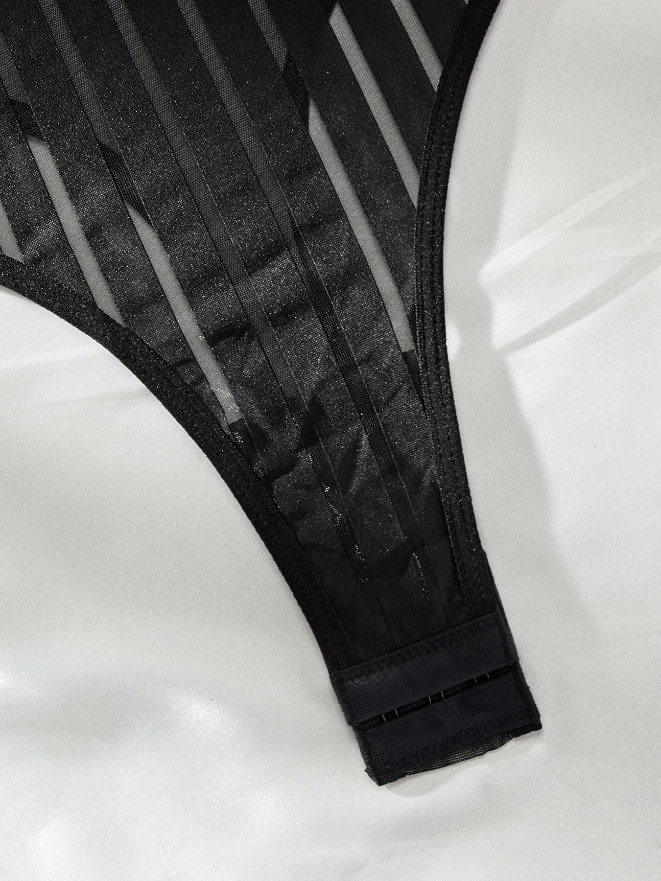 Lumina Vancouver Emmanuelle Bodysuit in sleek fabric, featuring a fitted design and stylish neckline.