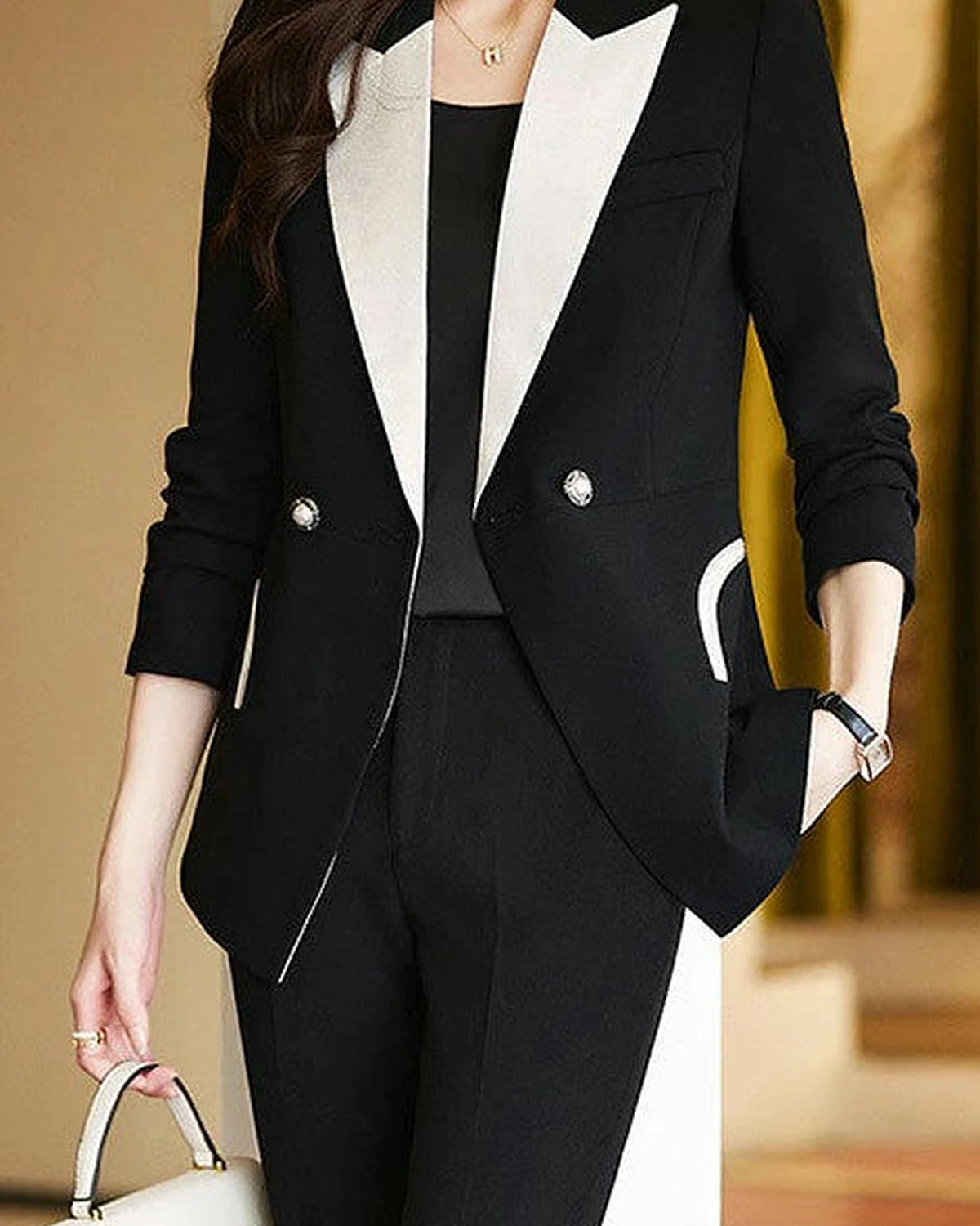 Black monochrome tailored pant suit set by Lumina Wear featuring a sleek, structured design for a sophisticated professional look.