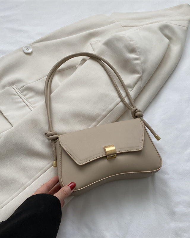 Terracotta-colored Lumina Wear Cécile sleek mini shoulder handbag with elegant design and smooth leather finish.